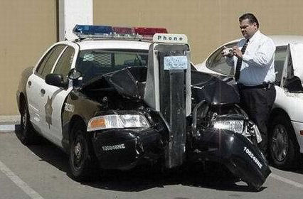 cop car wrapped around a pay phone