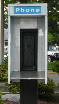 Empty pay phone stand in Oregon